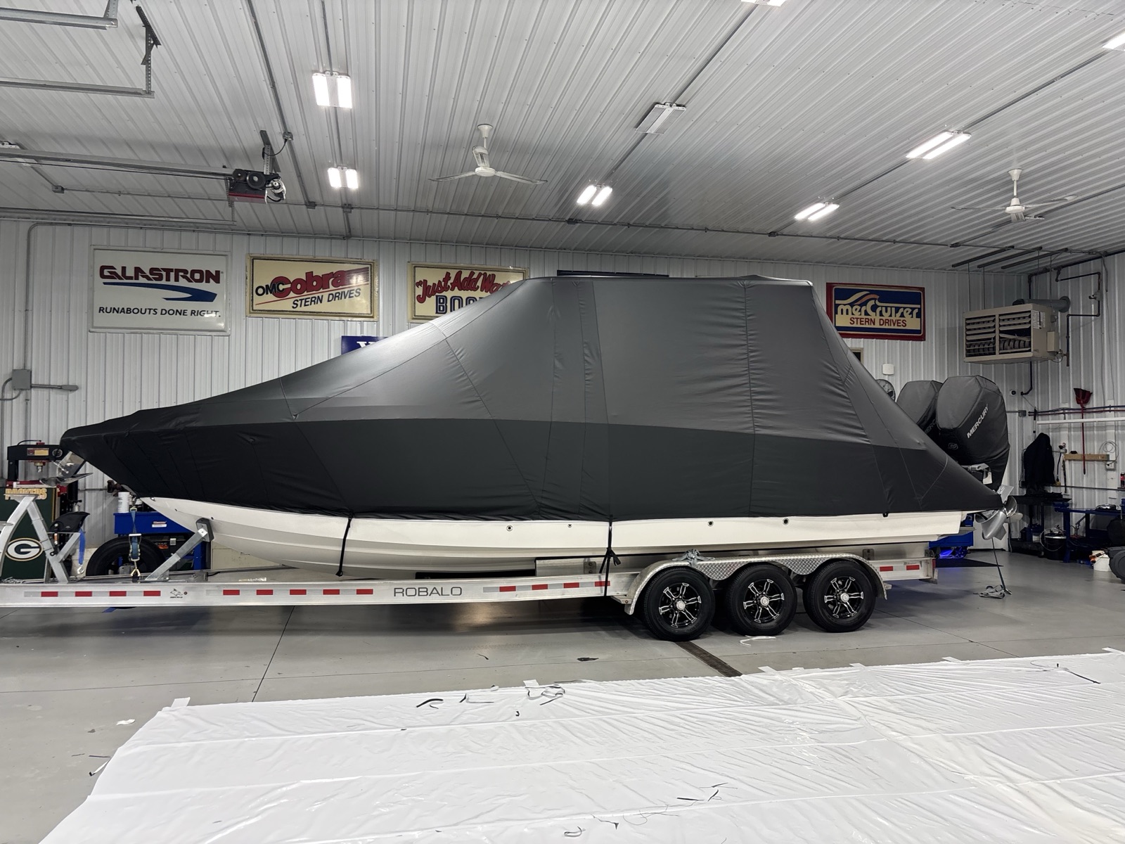 Custom T-top and outboard covers on Robalo center console