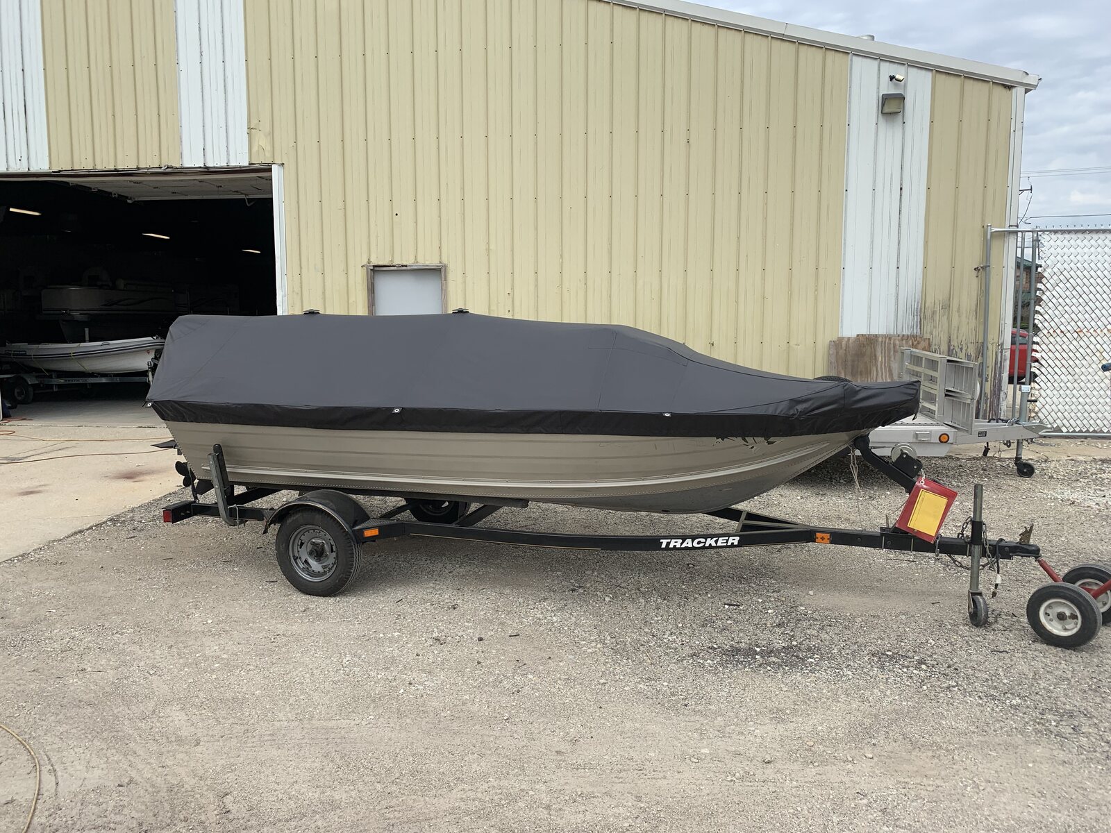 Charcoal cover on an aluminum boat