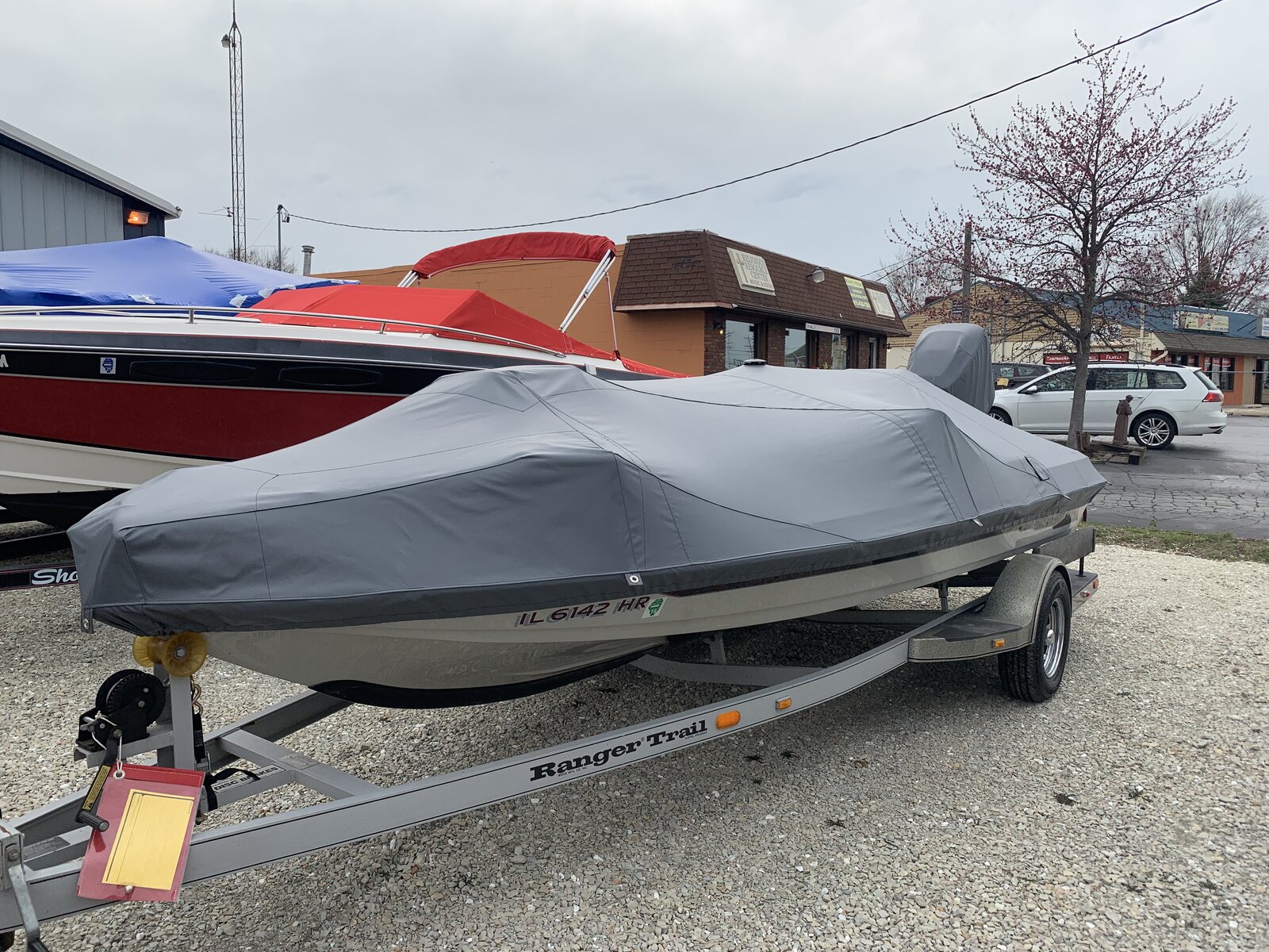 Gray custom cover on a bass boat outdoors on a trailer