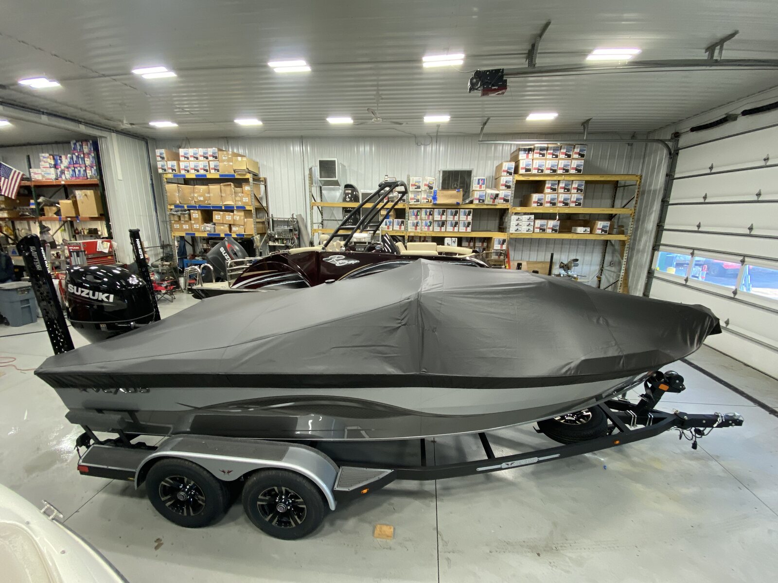 Gray fitted boat cover in a bright showroom