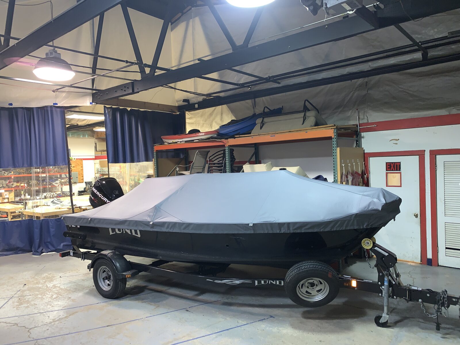 Gray fitted cover on a Lund fishing boat