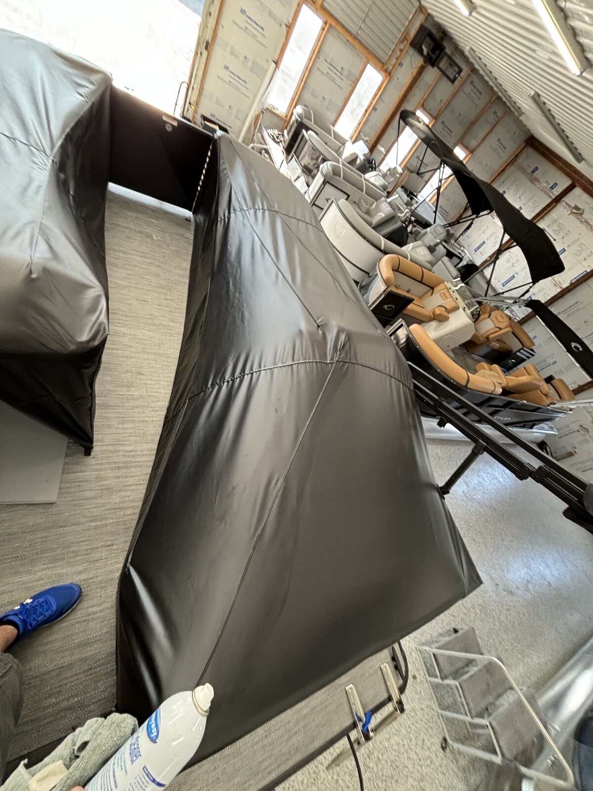 Black pontoon cover being fitted on site